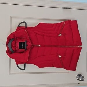 Talbots red puffer vest with gold accents.